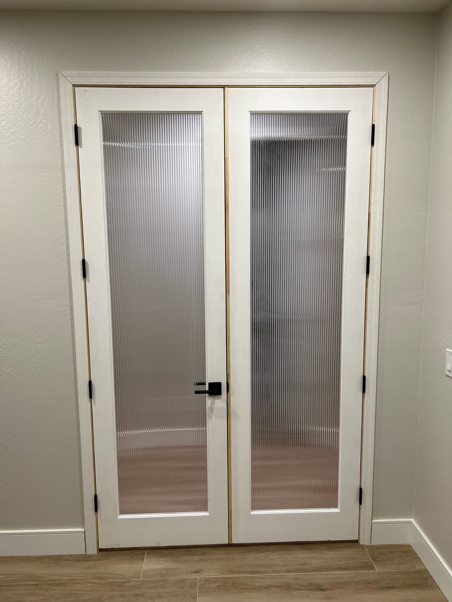 Modern Double Doors with Reeded Glass Enhance Privacy image